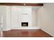 White brick fireplace in a living room with hardwood floors at 201 Tranquility Cv, Altamonte Springs, FL 32701