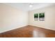 Bright bedroom featuring hardwood floors and a large window at 201 Tranquility Cv, Altamonte Springs, FL 32701