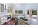 Updated kitchen with granite countertops, stainless steel appliances, and water views at 201 Tranquility Cv, Altamonte Springs, FL 32701