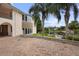 Brick driveway with circular design and a view of the lake at 201 Tranquility Cv, Altamonte Springs, FL 32701