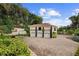 Three-car garage with second-floor bonus room and paver driveway at 201 Tranquility Cv, Altamonte Springs, FL 32701