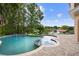 Freeform pool with spa and expansive patio overlooking the lake at 201 Tranquility Cv, Altamonte Springs, FL 32701