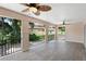 Spacious covered patio with wood-look tile flooring and tranquil views at 201 Tranquility Cv, Altamonte Springs, FL 32701