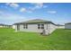 New construction home with a large backyard and AC unit at 1717 Forest Run Ln, Auburndale, FL 33823