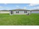 New home with a spacious backyard, providing ample outdoor space at 1717 Forest Run Ln, Auburndale, FL 33823