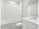 Clean bathroom with white tile and vanity at 1717 Forest Run Ln, Auburndale, FL 33823