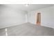 Bright and airy bedroom with grey carpet and an ensuite bathroom at 1717 Forest Run Ln, Auburndale, FL 33823
