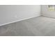 Well-lit bedroom with grey carpet and an open feel at 1717 Forest Run Ln, Auburndale, FL 33823