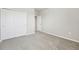 Bright bedroom featuring carpet flooring and an ensuite bathroom at 1717 Forest Run Ln, Auburndale, FL 33823