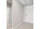 Clean entryway with tile floor and white door at 1717 Forest Run Ln, Auburndale, FL 33823