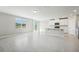 Open concept kitchen with island, stainless steel appliances, and white cabinets at 1717 Forest Run Ln, Auburndale, FL 33823