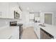 Bright kitchen featuring stainless steel appliances and white cabinets at 1717 Forest Run Ln, Auburndale, FL 33823