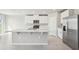 Open concept kitchen with island and stainless steel appliances at 1717 Forest Run Ln, Auburndale, FL 33823