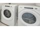 Laundry room with Whirlpool washer and dryer at 1717 Forest Run Ln, Auburndale, FL 33823
