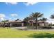 Community clubhouse with lush landscaping at 5299 Wildwood Way, Davenport, FL 33837