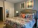 Bright bedroom with a comfortable queen-size bed and stylish decor at 5299 Wildwood Way, Davenport, FL 33837