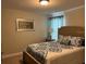 Cozy bedroom with a double bed and tasteful decor at 5299 Wildwood Way, Davenport, FL 33837