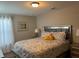 Main bedroom with king-size bed and gray bedding at 5299 Wildwood Way, Davenport, FL 33837