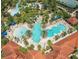 Large community pool with surrounding amenities at 5299 Wildwood Way, Davenport, FL 33837