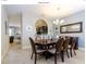 Elegant dining room featuring a large wood table and six chairs at 5299 Wildwood Way, Davenport, FL 33837