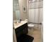 Simple bathroom with single vanity and shower/tub combo at 5299 Wildwood Way, Davenport, FL 33837