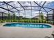 Screened pool and spa with outdoor seating at 5299 Wildwood Way, Davenport, FL 33837