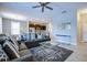 Spacious living room with gray sectional sofa and coffee table at 5299 Wildwood Way, Davenport, FL 33837