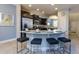 Kitchen with breakfast bar and stainless steel appliances at 5299 Wildwood Way, Davenport, FL 33837