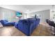 Relaxing living room with sectional sofa and large TV at 1233 Nelson Park Court, Poinciana, FL 34759