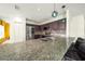 Modern kitchen with granite countertops and stainless steel appliances at 1233 Nelson Park Court, Poinciana, FL 34759