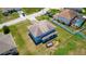 Two-story house with a large backyard and covered patio at 1233 Nelson Park Court, Poinciana, FL 34759
