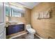 Modern bathroom with updated vanity and fixtures at 1233 Nelson Park Court, Poinciana, FL 34759