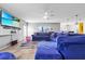 Relaxing living room with sectional sofa and large TV at 1233 Nelson Park Court, Poinciana, FL 34759