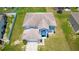 Two-story house with a large yard and two-car garage at 1233 Nelson Park Court, Poinciana, FL 34759