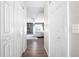 Bright hallway connecting to bedrooms with new flooring at 1233 Nelson Park Court, Poinciana, FL 34759