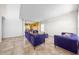 Open living room with tiled floors and stylish sofas at 1233 Nelson Park Court, Poinciana, FL 34759