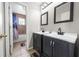 Bathroom with double sinks and updated cabinets at 1233 Nelson Park Court, Poinciana, FL 34759