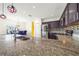 Modern kitchen with granite countertops and stainless steel appliances at 1233 Nelson Park Court, Poinciana, FL 34759
