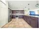 Modern kitchen with granite countertops and stainless steel appliances at 1233 Nelson Park Court, Poinciana, FL 34759