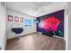 Charming bedroom with a large floral wall mural at 1233 Nelson Park Court, Poinciana, FL 34759