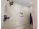 Clean shower with tile surround and built-in niche at 1233 Nelson Park Court, Poinciana, FL 34759