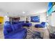 Relaxing living room with sectional sofa and large TV at 1233 Nelson Park Court, Poinciana, FL 34759