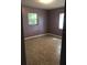 Spacious bedroom with tile floors and purple walls at 2107 Vincent Rd, Orlando, FL 32817