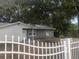 Newly painted house with a white picket fence and spacious yard at 2107 Vincent Rd, Orlando, FL 32817