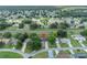 Aerial view showing home with pool and solar panels in a residential neighborhood at 832 Valnera Ct, Kissimmee, FL 34758