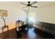 Home office with a desk and comfortable couch at 306 Athabasca Pl, Kissimmee, FL 34759