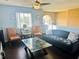 Bright bonus room with hardwood floors and seating area at 306 Athabasca Pl, Kissimmee, FL 34759