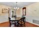 Dining room with an oval table and chairs, yellow wallpaper and a chandelier at 222 Adelaide Blvd, Altamonte Springs, FL 32701