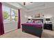 Main bedroom with large window and ceiling fan at 2650 Tahoe Ter, Saint Cloud, FL 34771