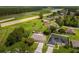 Aerial view showcasing a house and surrounding neighborhood near a highway at 349 Chelmsford Ct, Kissimmee, FL 34758